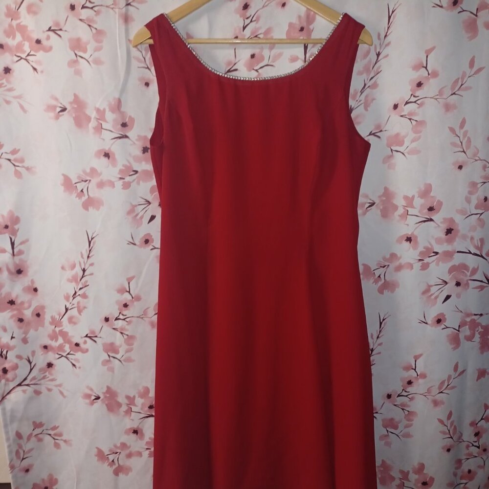 red dress adorned w Rhine stone neckline